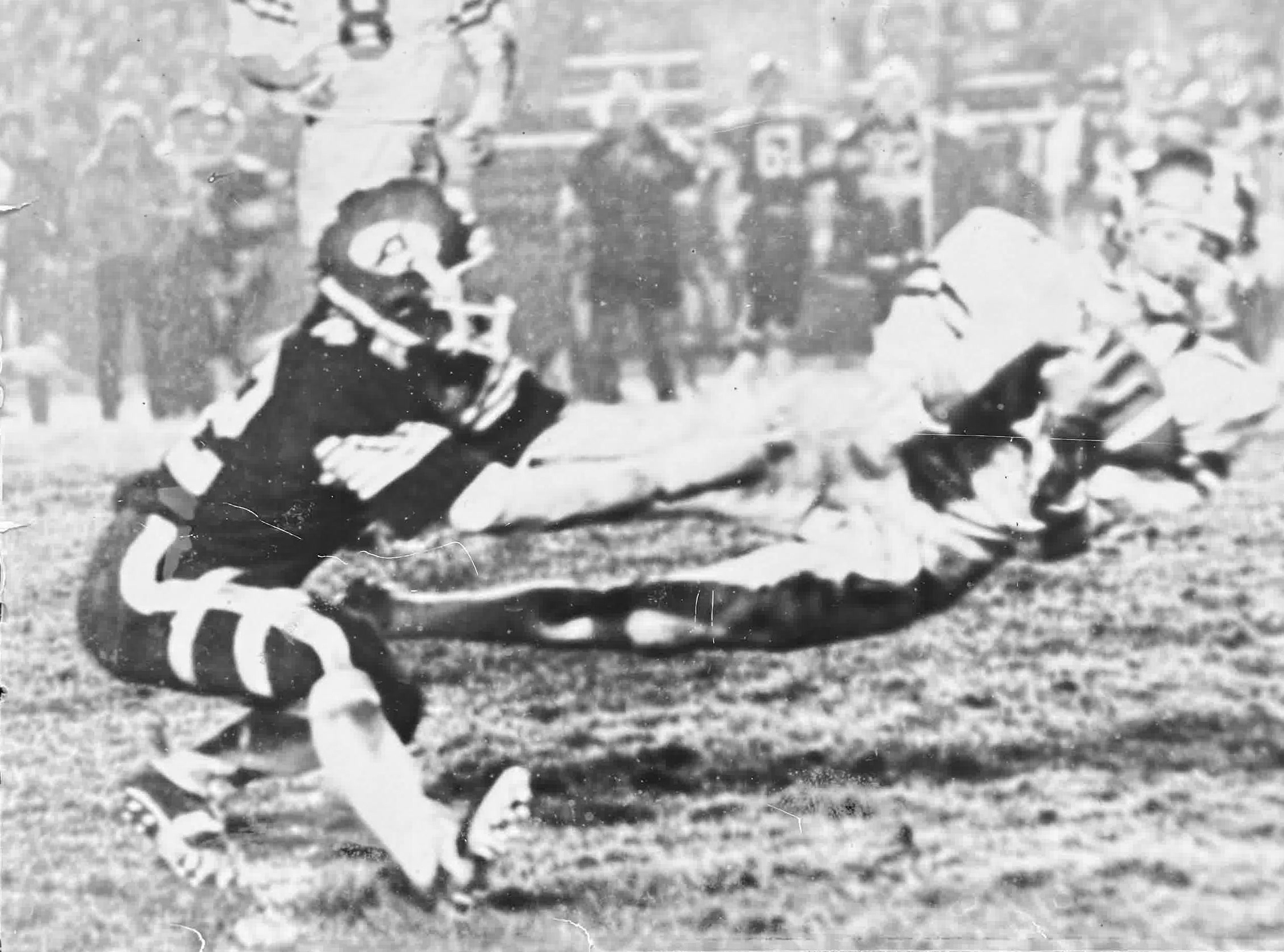 Restored black-and-white championship game action photograph of Steve Main at Thompson Field